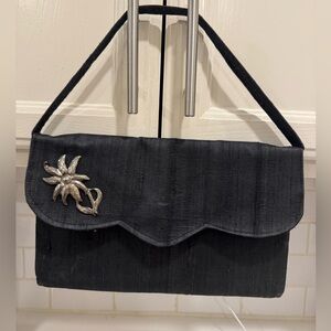 Elegant Clutch with Silver Flower Accent